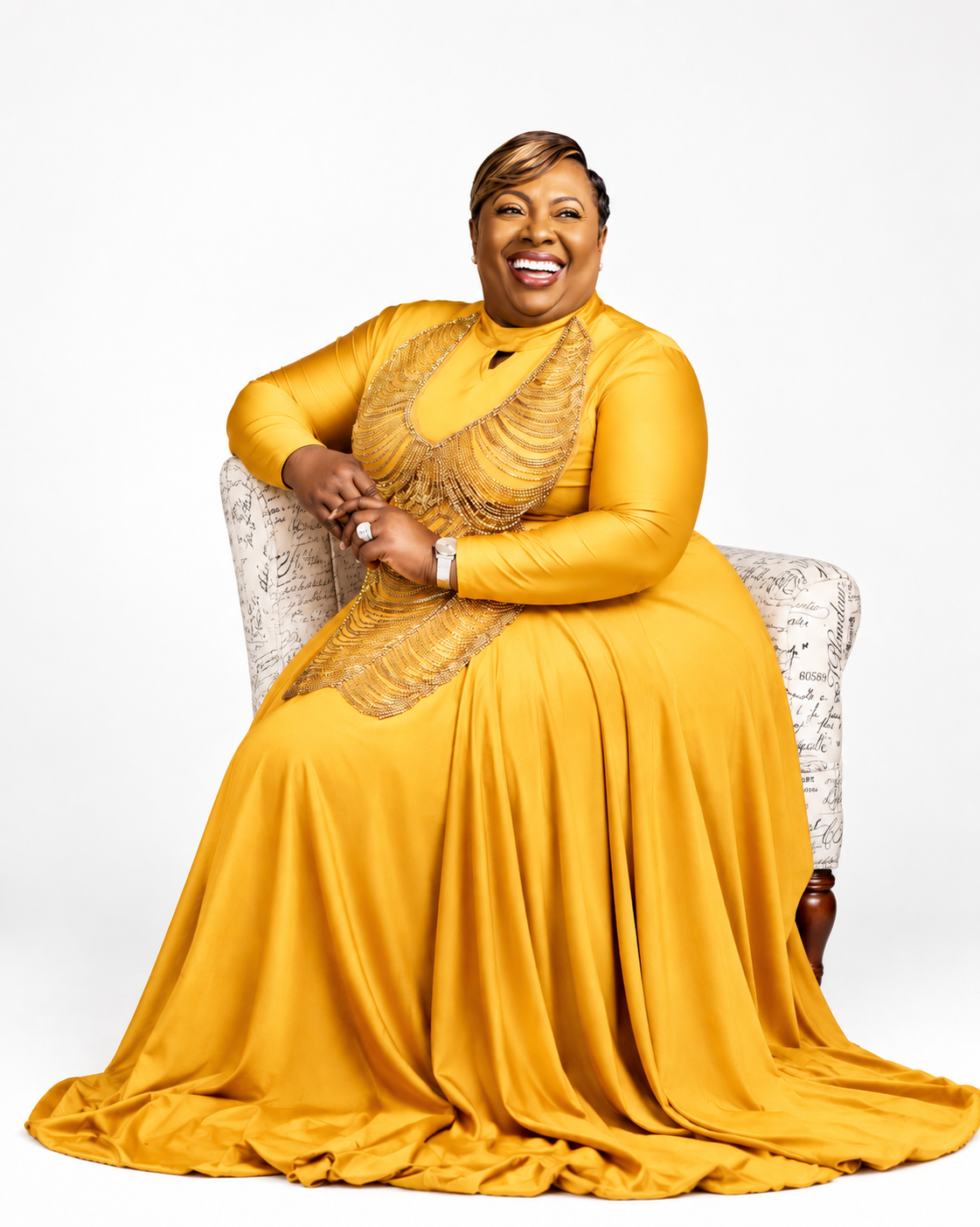 Prophetess Dr. Mattie Nottage in a flowing gold beaded gown